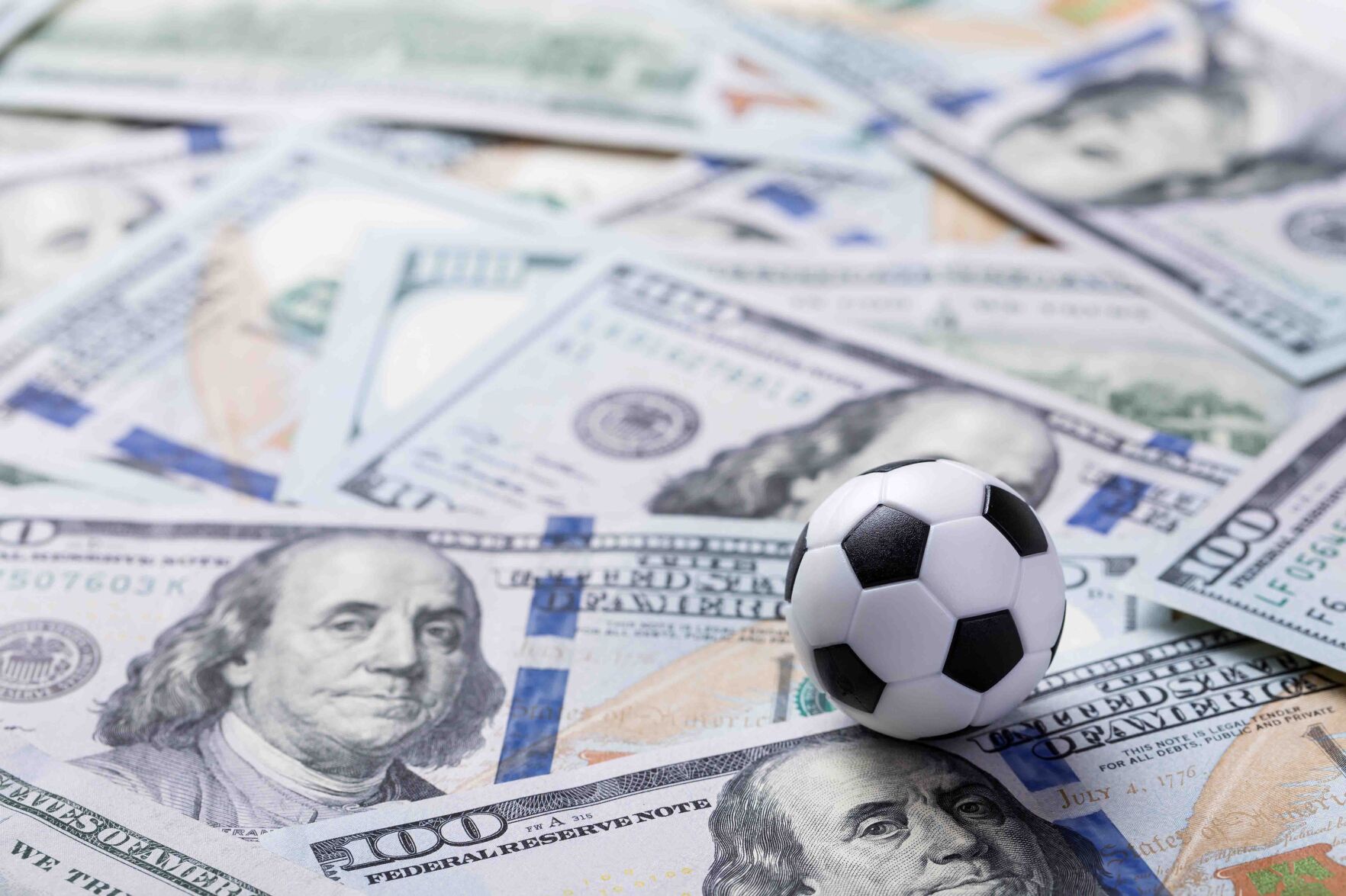 Soccer ball on dollar banknotes